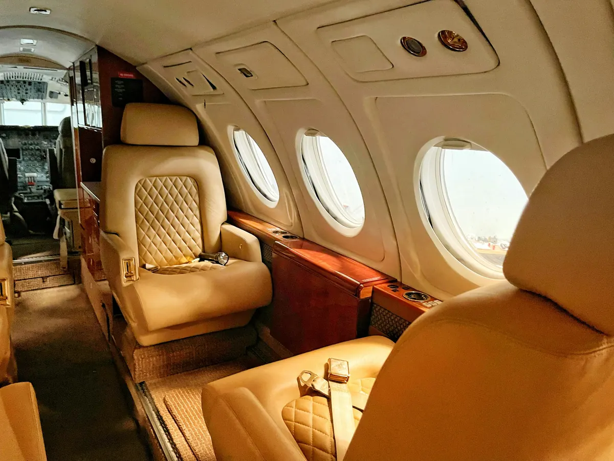 A warm leather cabin aboard a private jet